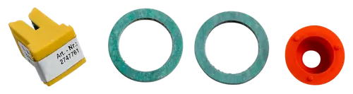 Vier Komponenten eines Umrüstsatzes, darunter ein gelber Stecker und zwei Ringe in verschiedenen Farben, möglicherweise für einen Wolf TGB-2-30.